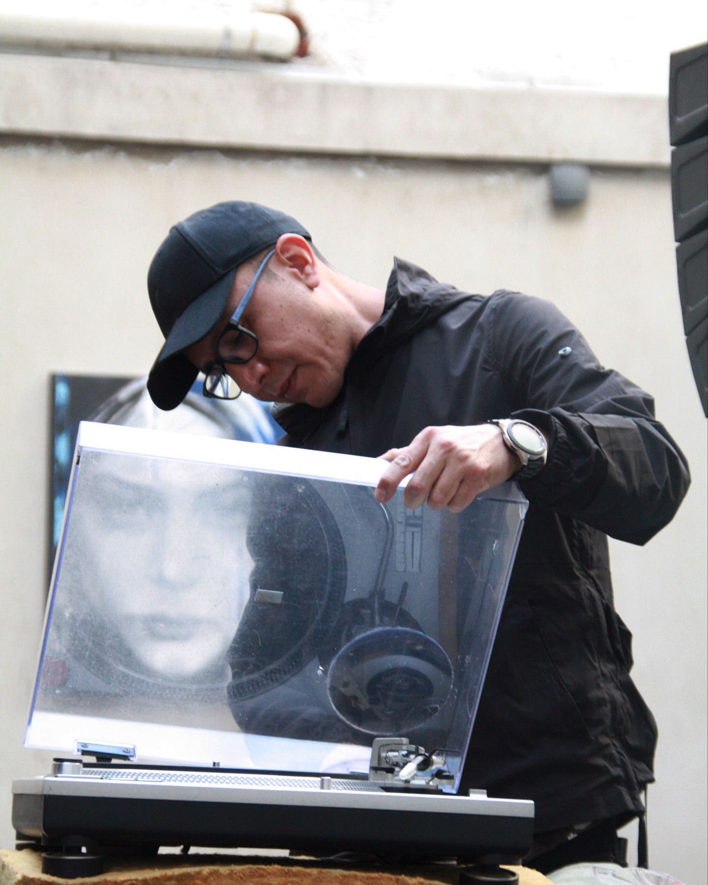 Candid photo with a record player at a studio event